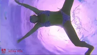 Amazing underwater bikini show. elegant flexible baby swimming underwater in the pool