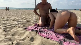 She sucks her cock on the nudist beach in front of people watching and touching her